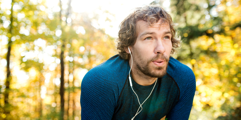 Man jogging in the autumn forest